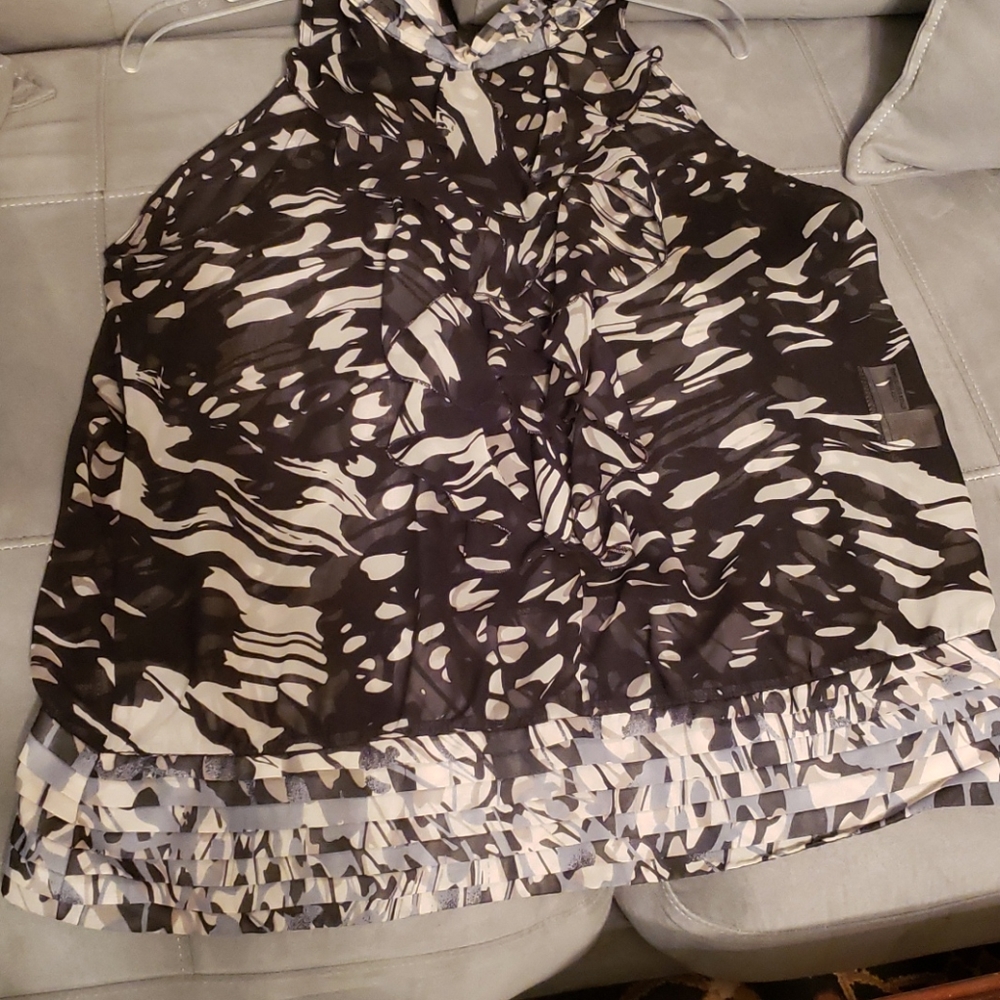 Button around the neck and on one side sheer shirt